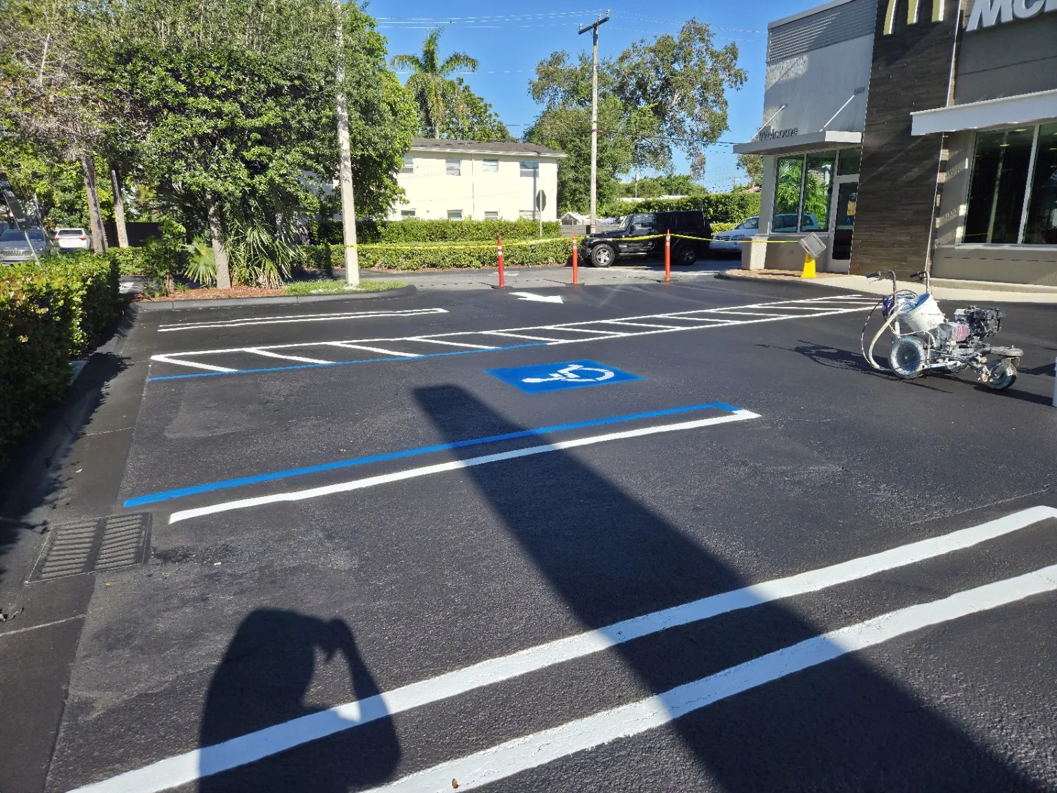 Fresh accessible parking markings and striped access aisle