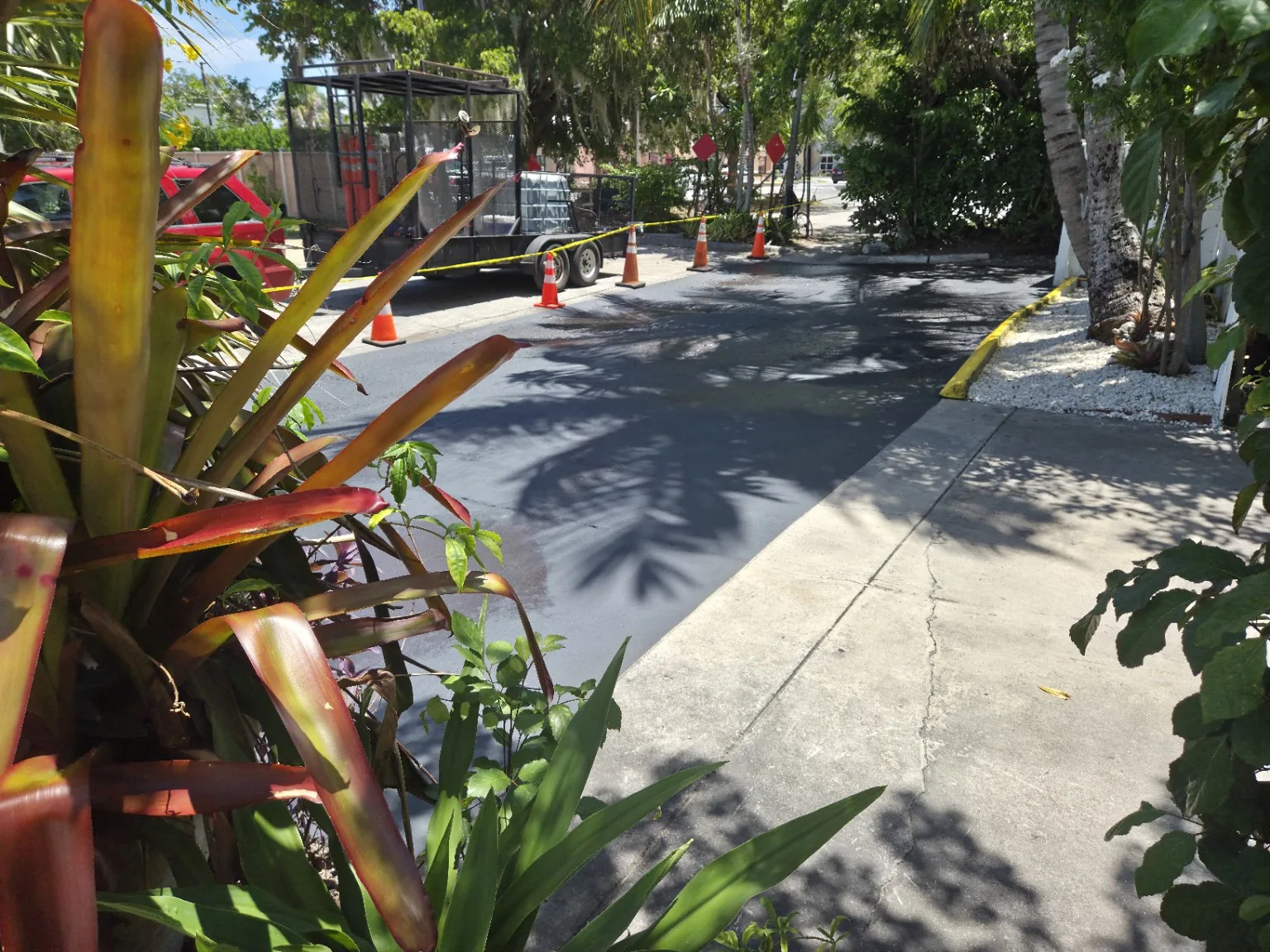 Freshly sealcoated small property access lane